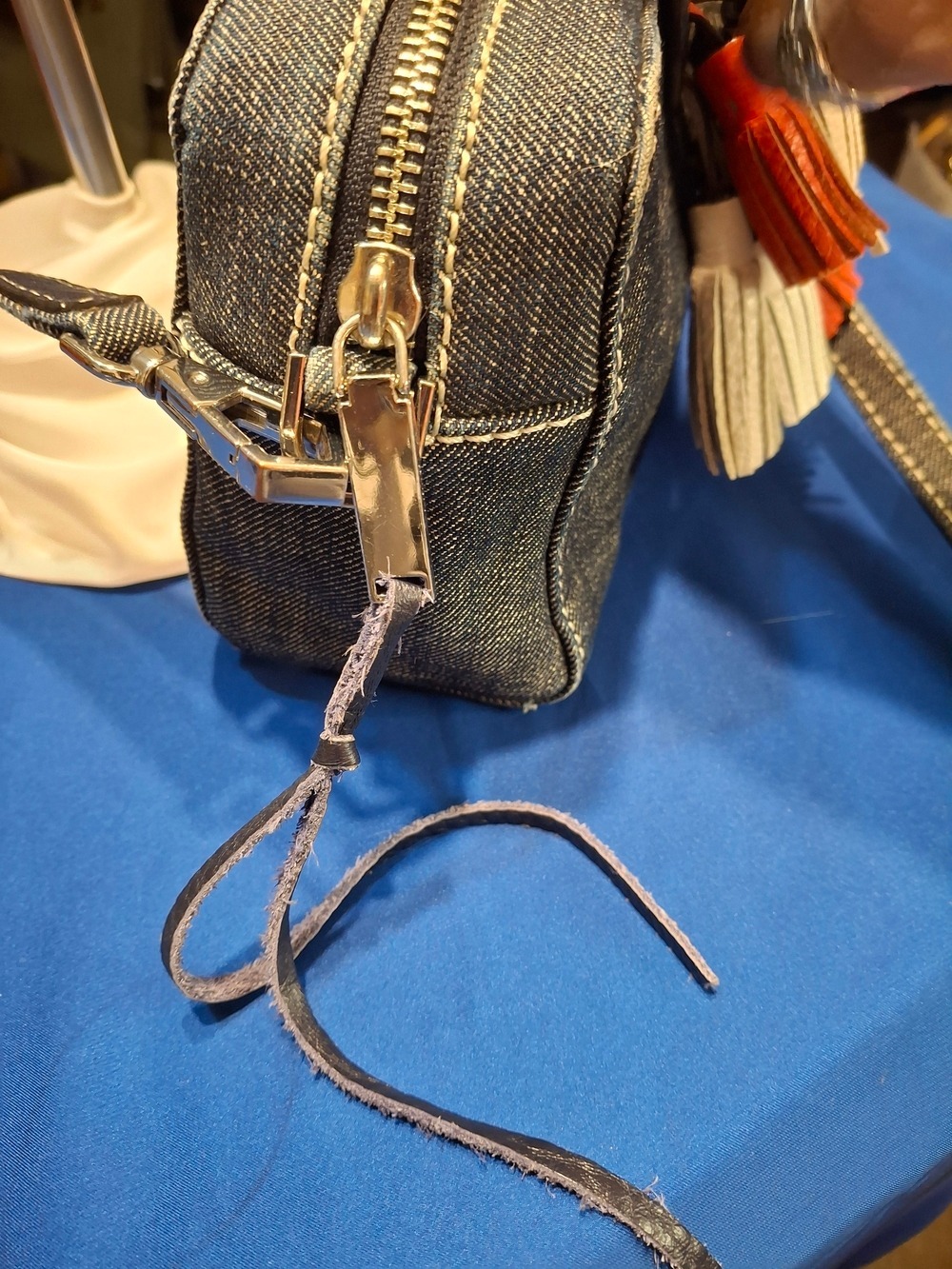 Rebecca Minkoff Mini Sofia Denim Crossbody Bag with Orange and Cream Tassels - Picture 6 of 11